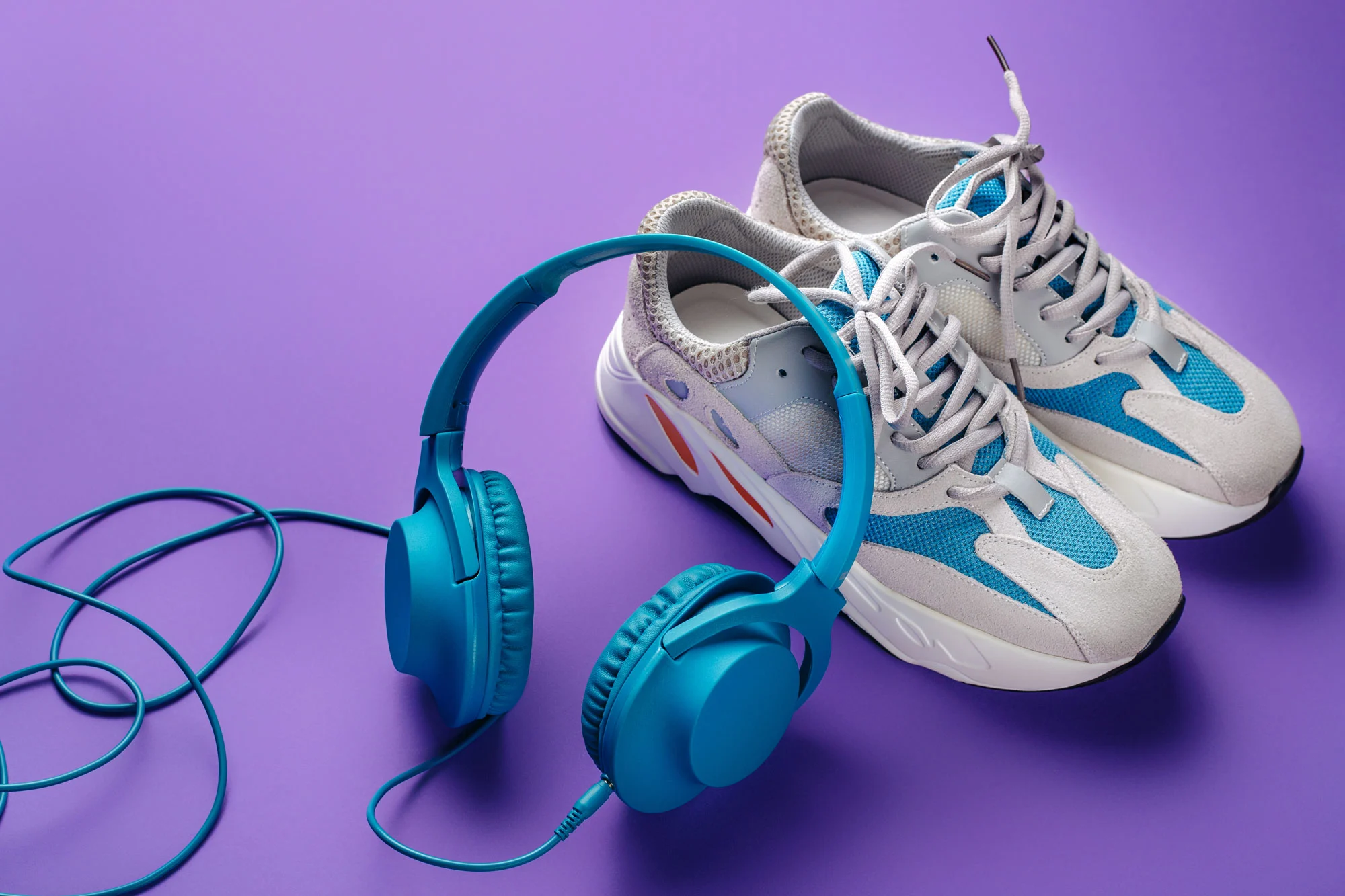 Stylish Blue Headphone And Sport Shoes On Purple B 2026 01 09 10 58 49 Utc2 1
